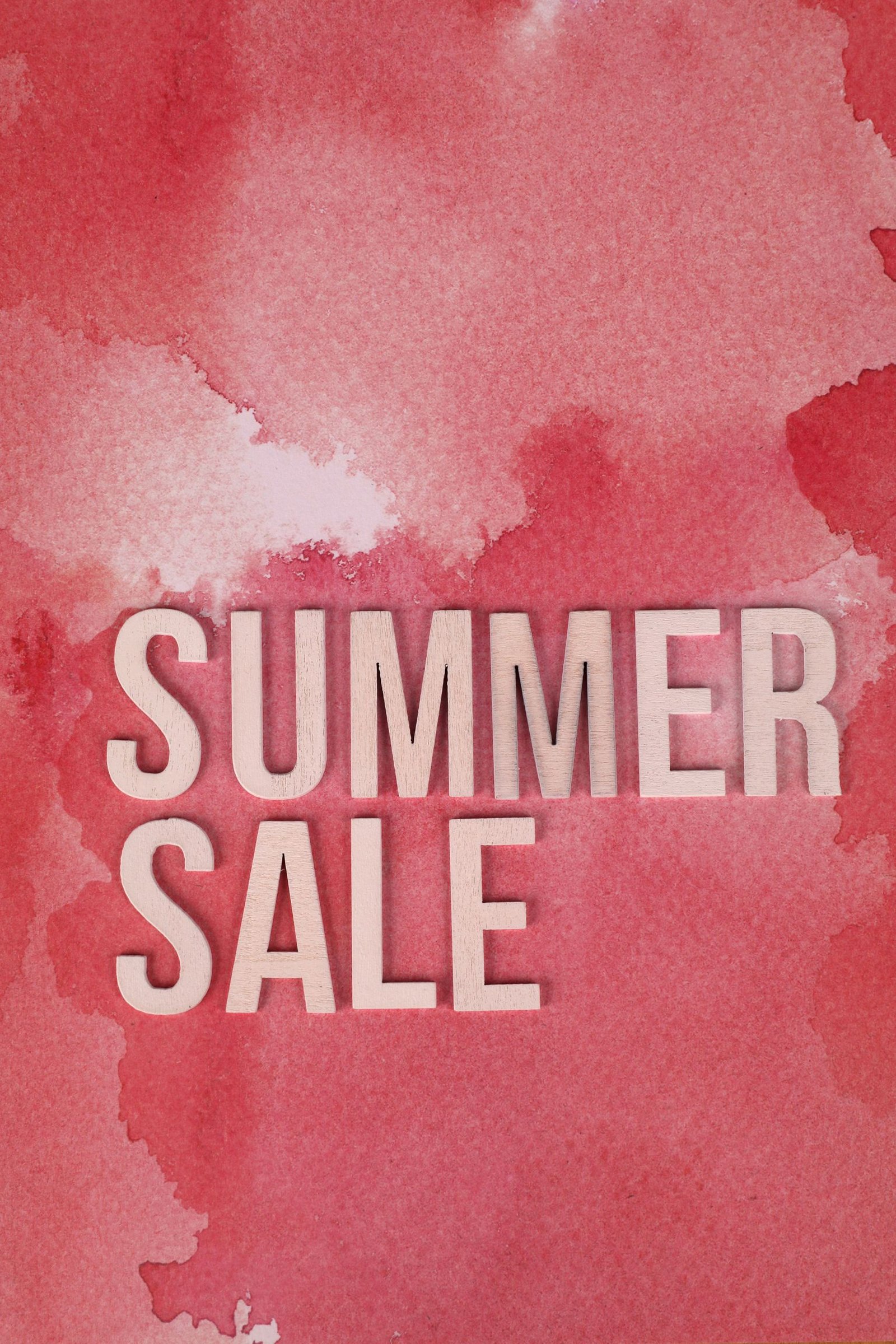 Bright watercolor background with 'Summer Sale' text, perfect for seasonal marketing.
